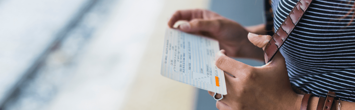 Woman looking at the ticket