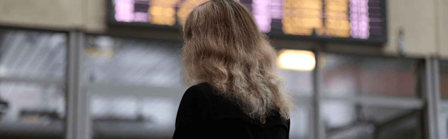 Woman looking at the train schedule