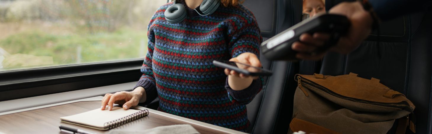 Woman pays for ticket on train