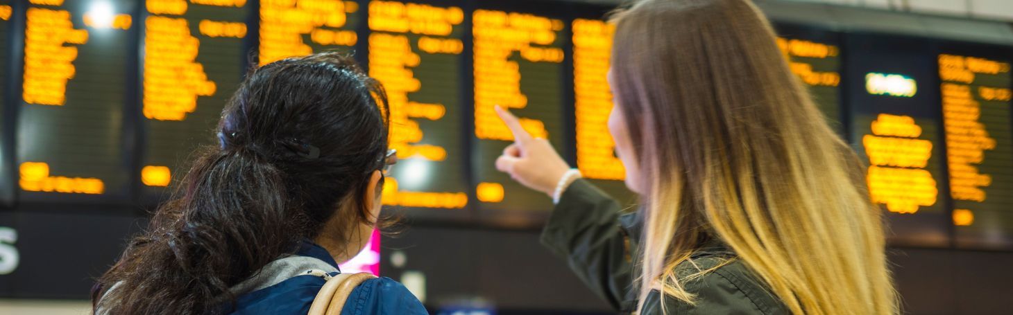 Women looking at the train schedule