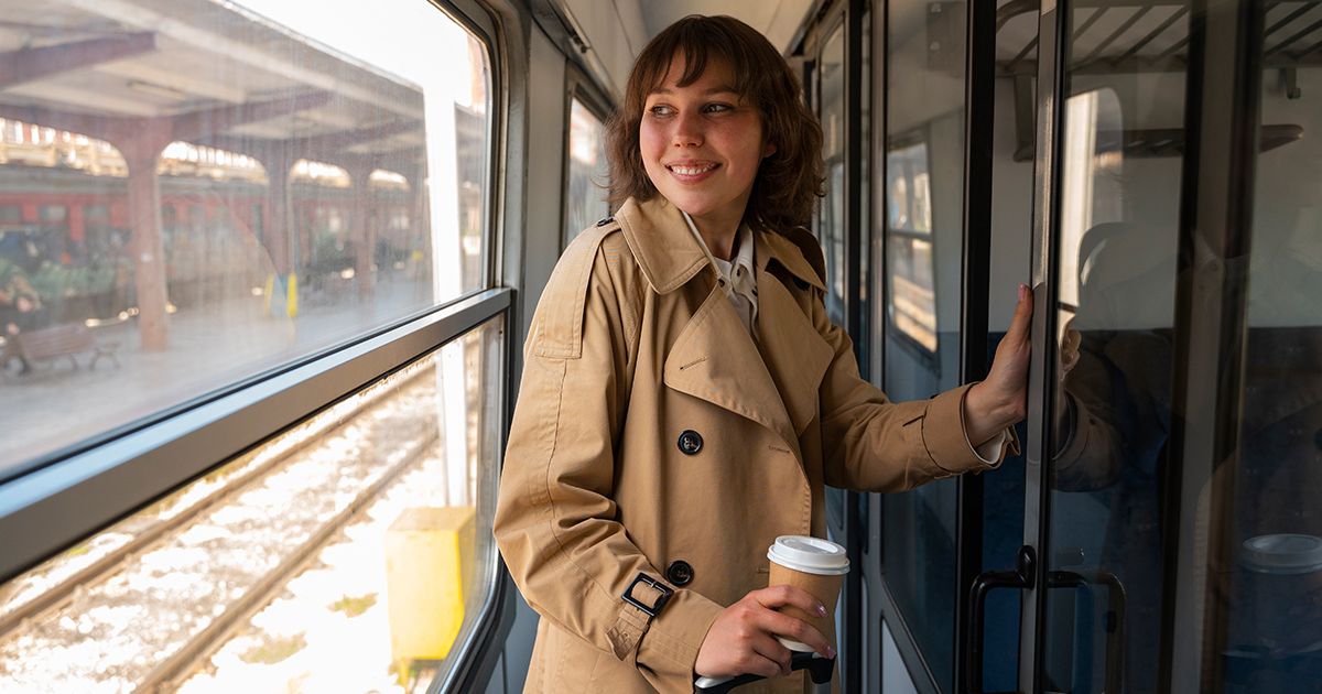 Woman in a corridor in a compartment carriage
