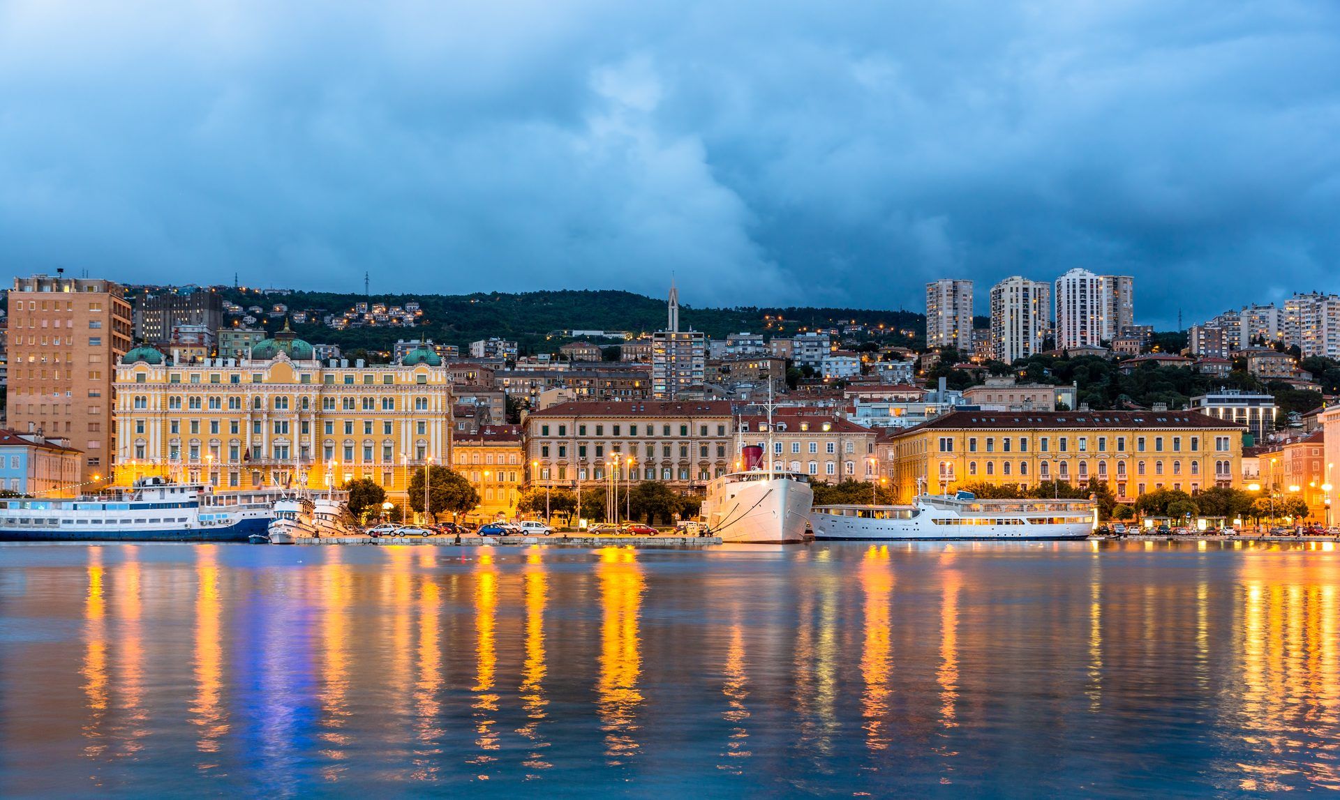 Panoramic view of Rijeka's port at night — the Adriatic Express arrives here at 10:04