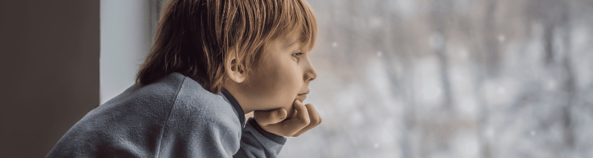 child looking out the window - winter holidays swietokrzyskie - when