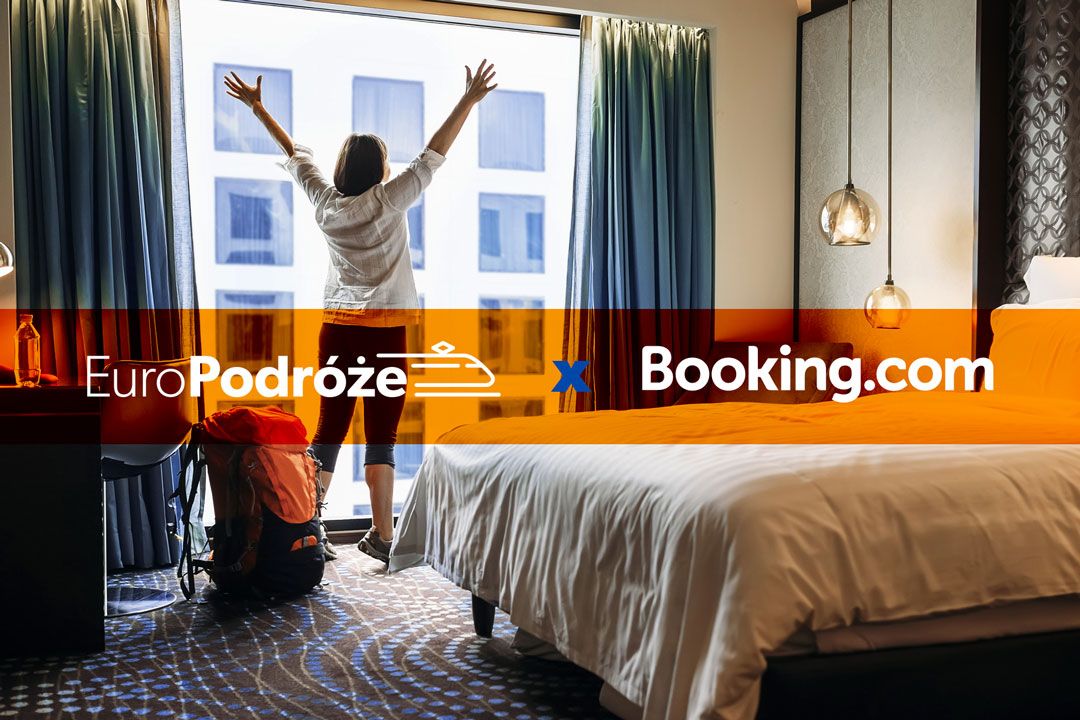 photo: a woman looks through a hotel window