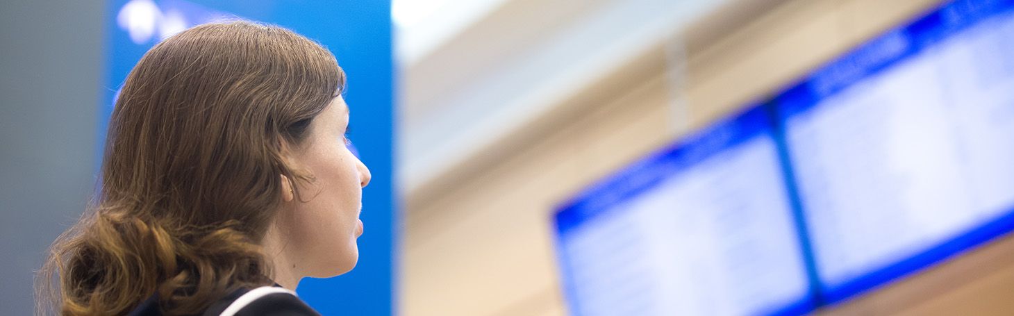 Woman looking at the timetable