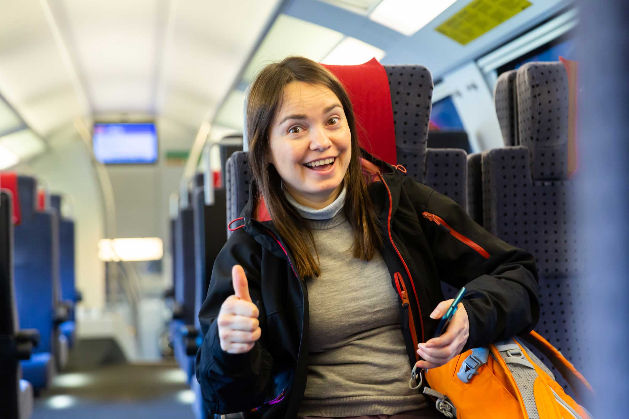 photo: satisfied train passenger shows thumbs up