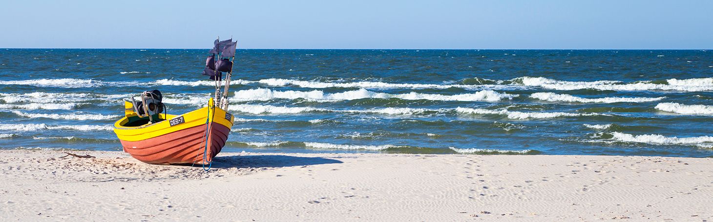 Trains to the sea A boat on the beach