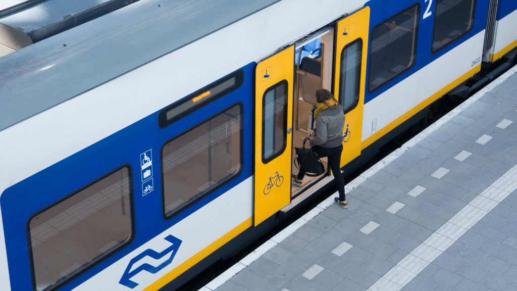 Katowice Olomouc train - travel time and cost Person boarding the train