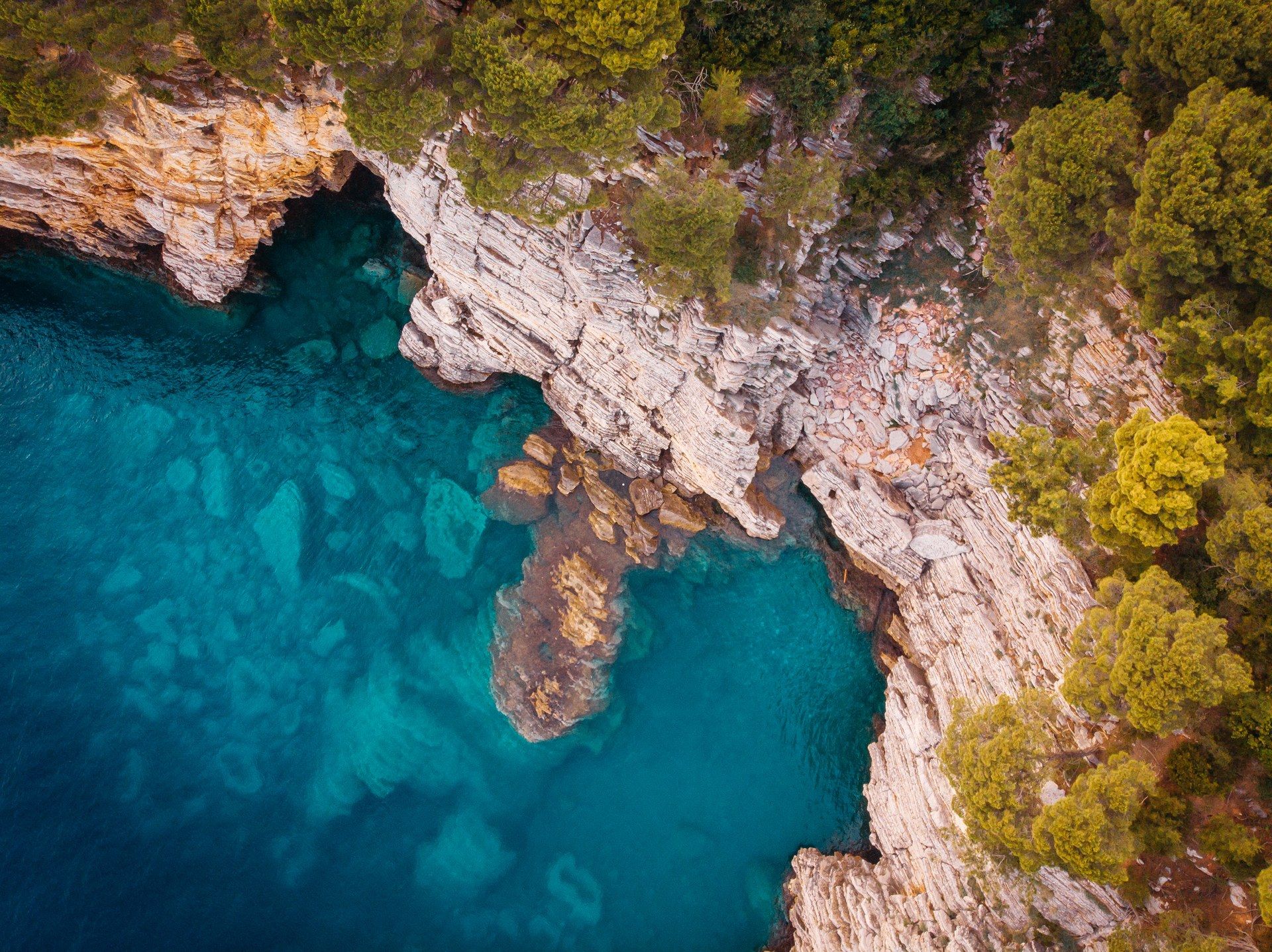 Rocky Adriatic coast in Croatia Drone view of Croatia's rocky Adriatic coast with crystal-clear turquoise water