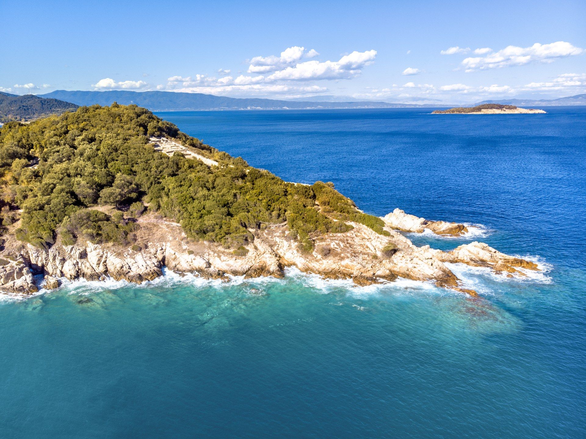 Stony, rocky coast of Croatia Drone view of Croatia's rocky, pebble Adriatic coast with crystal-clear turquoise water